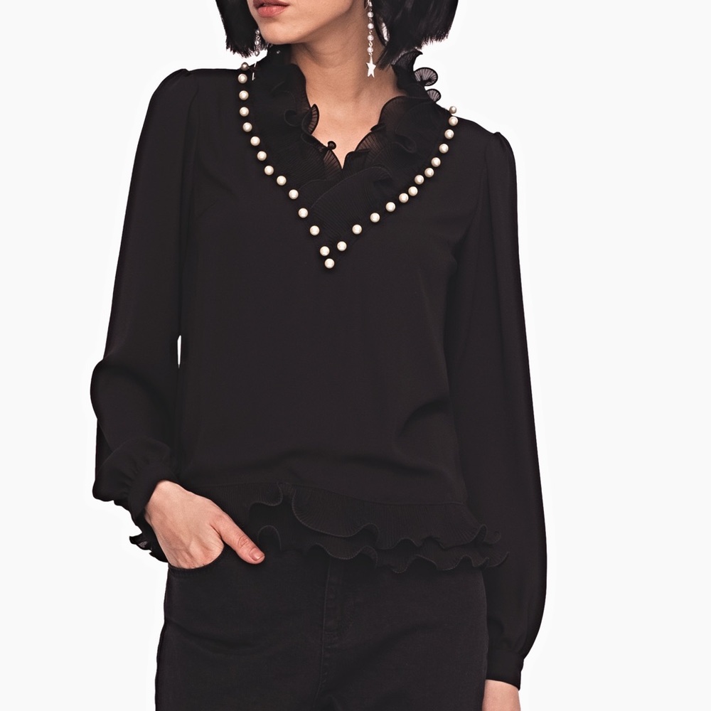 Black blouse with ruffles and pearl on the neck